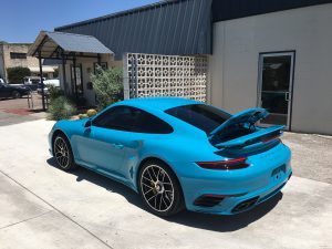 Baby blue Porsche with window tinting