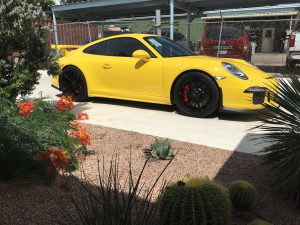 Yellow Porsche with window tint